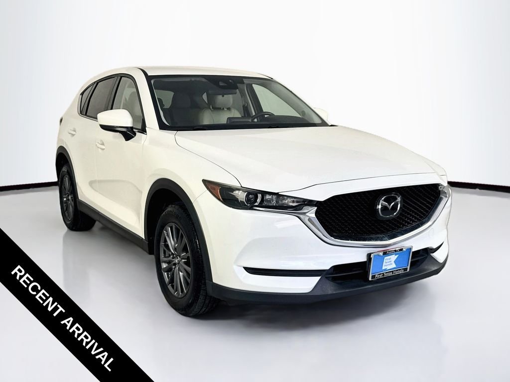 Used 2019 Snowflake White Pearl Mica Mazda Touring image 1