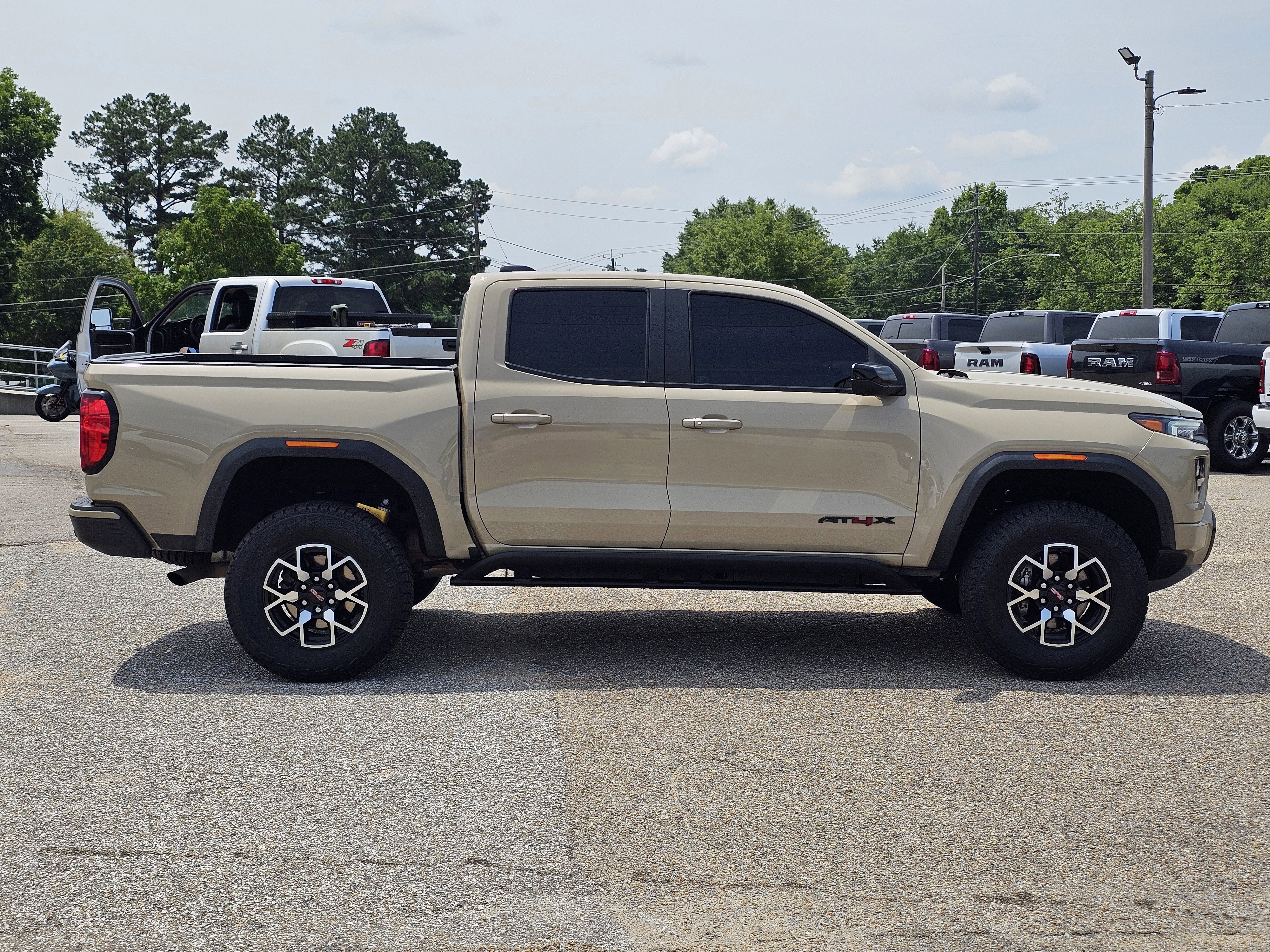 Used 2023 Desert Sand Metallic GMC 4WD AT4X image 8