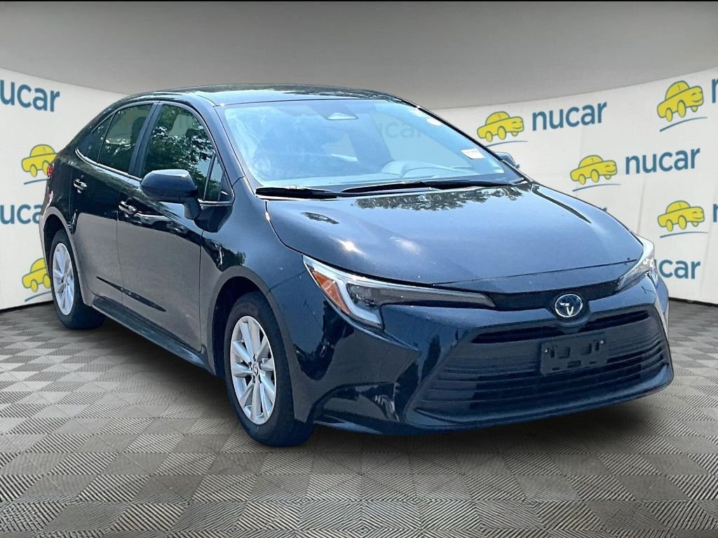 Used 2024 Black Toyota LE image 1