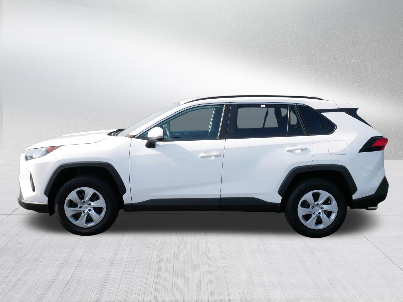 Used 2021 Super White Toyota LE image 4
