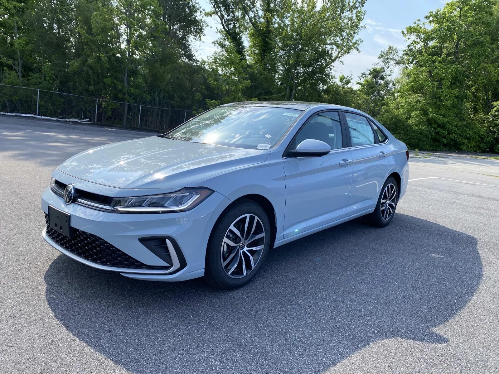 New 2026 Monument Gray Volkswagen SE Auto image 1