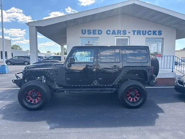 Used 2013 Black Jeep Unlimited Sahara image 3