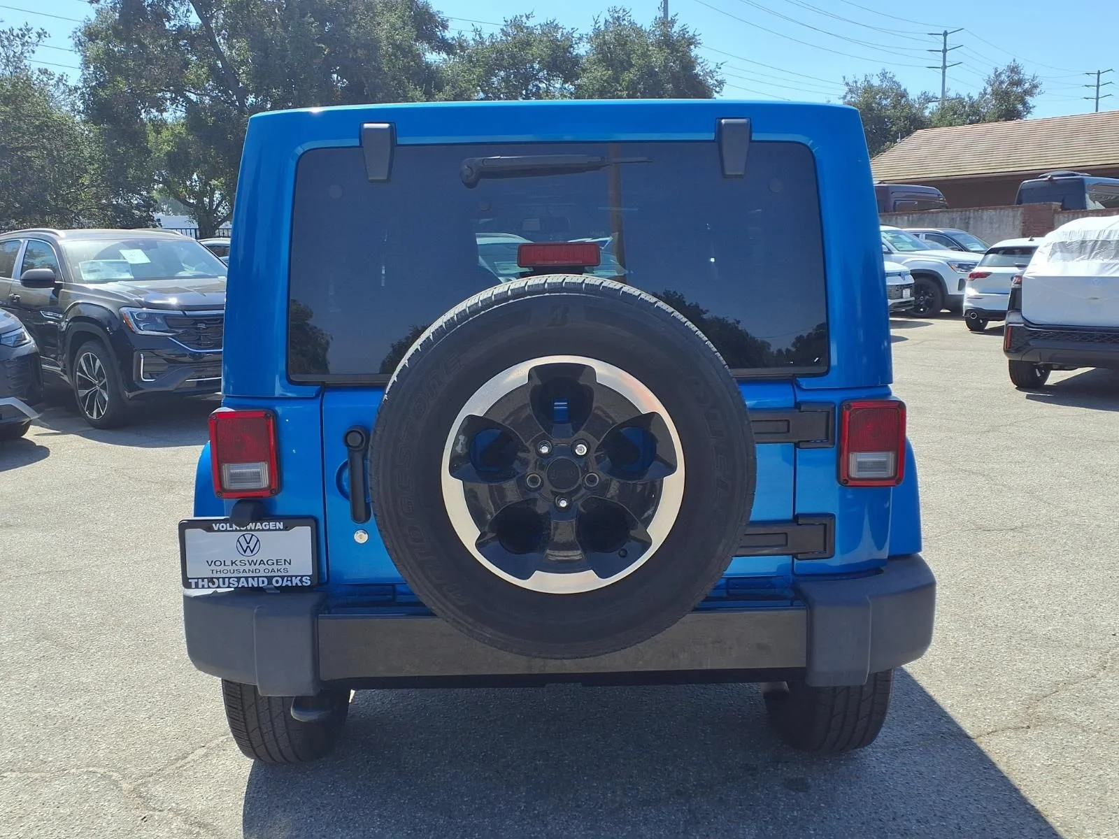 Used 2014 Blue Jeep Unlimited Sahara image 6