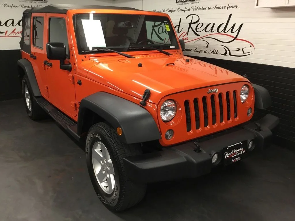 Used 2015 Orange Jeep Unlimited Sport image 2