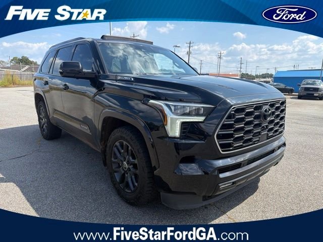 Used 2024 Black Toyota Platinum image 1