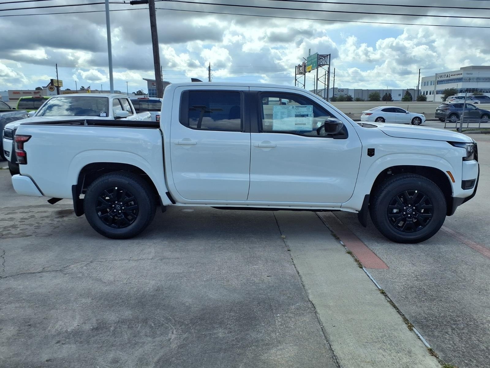 2026 Nissan Frontier Crew Cab SV White at Robbins Nissan
