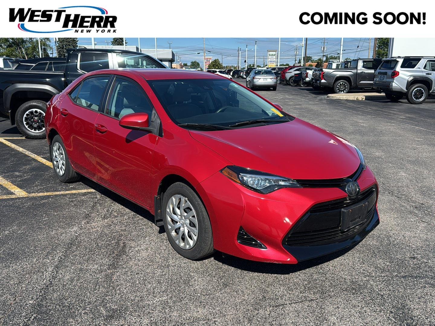 Used 2018 Barcelona Red Metallic Toyota LE image 1