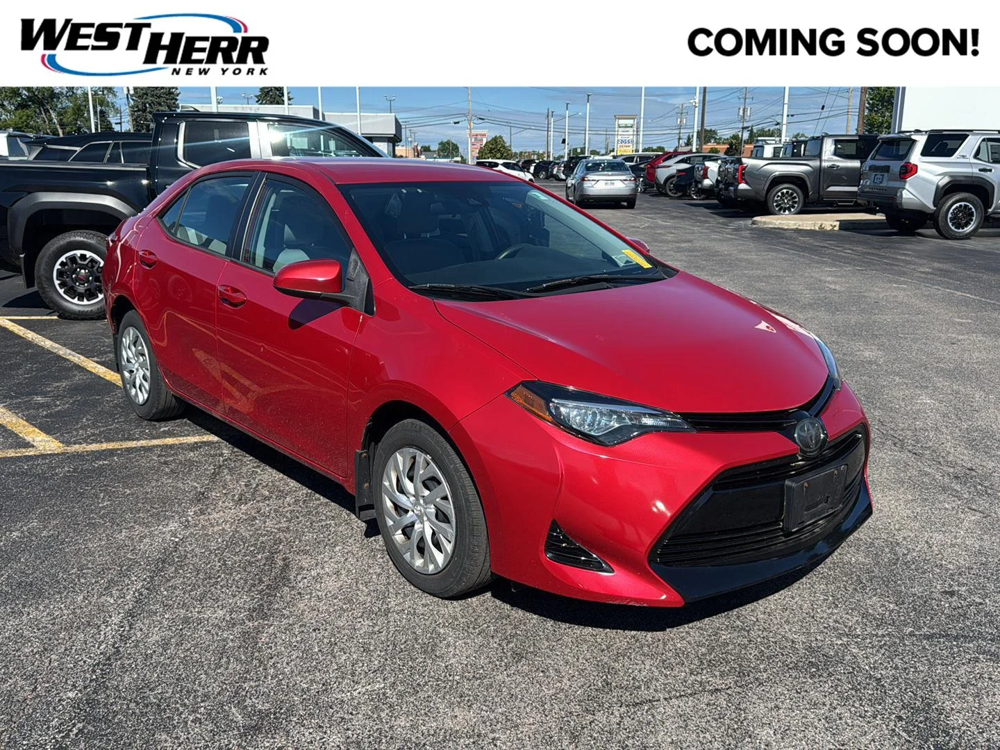 Used 2018 Barcelona Red Metallic Toyota LE image 1