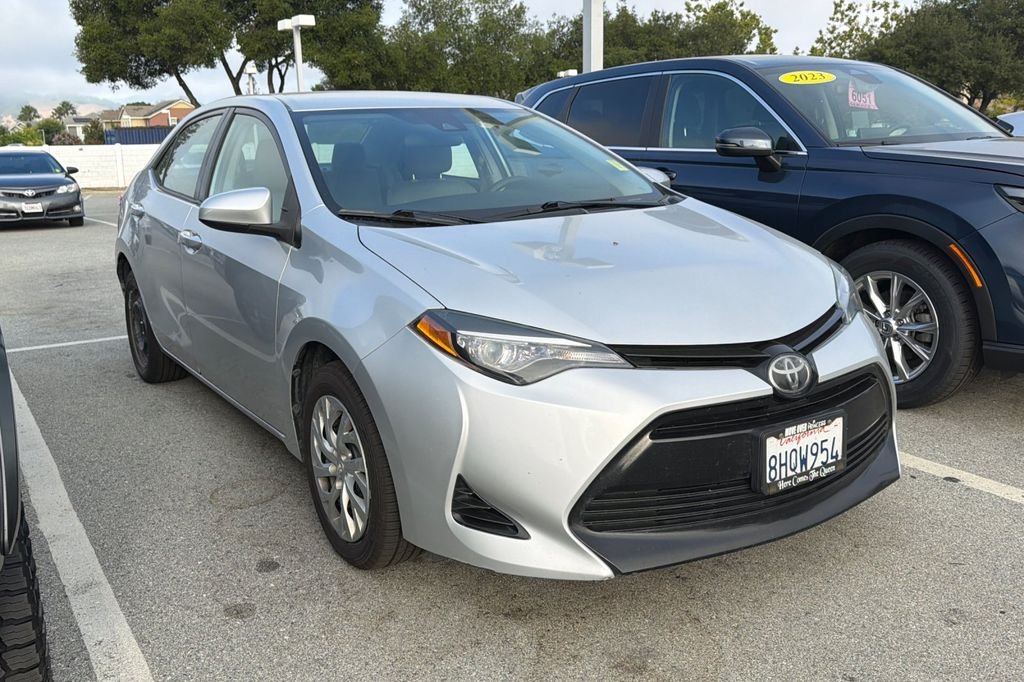 Used 2018 Classic Silver Metallic Toyota LE image 1