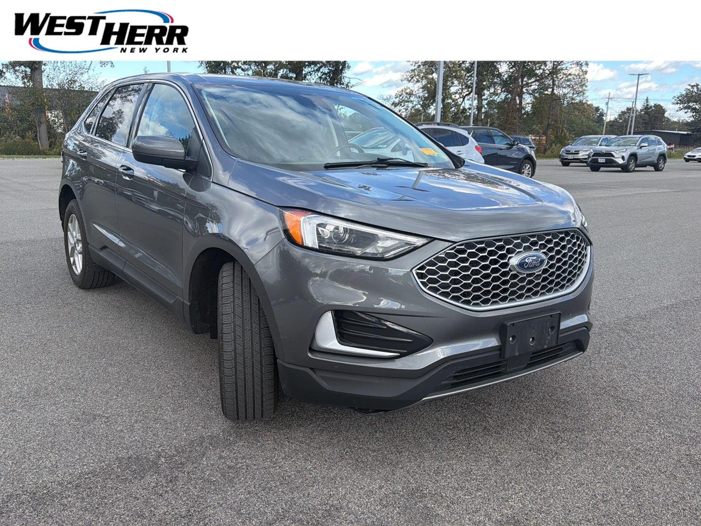 Used 2024 Carbonized Gray Ford SEL image 1