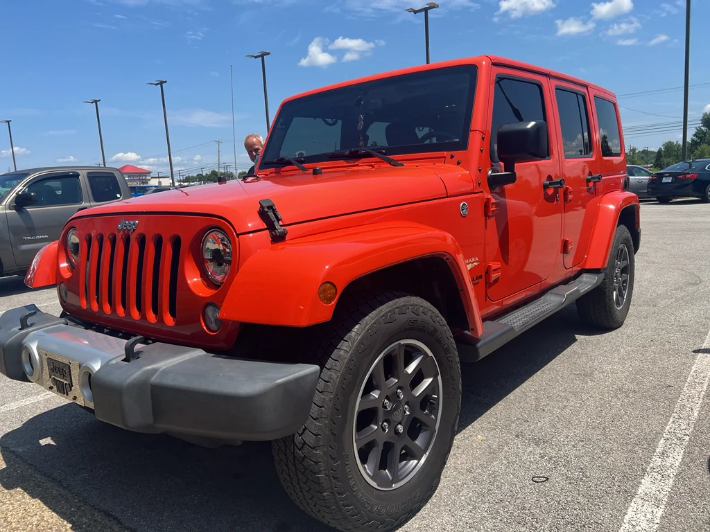 Used 2015 Sunset Orange Pearlcoat Jeep Sahara image 2