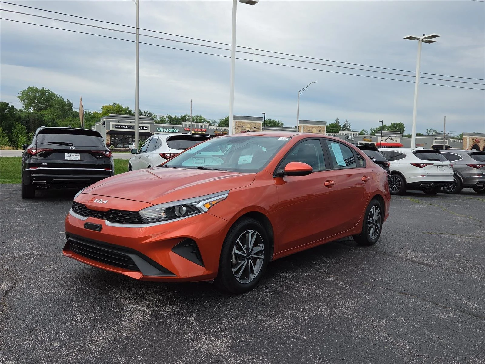 Used 2023 Fire Orange Kia LXS image 3