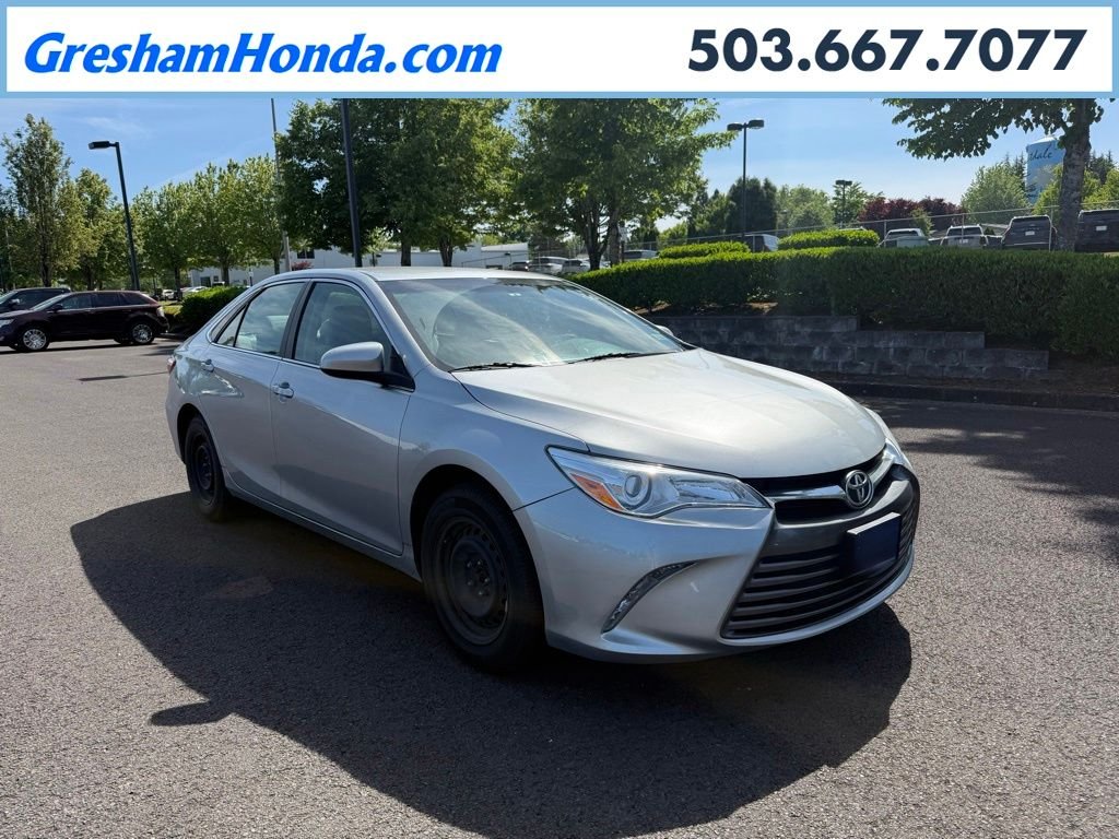 Used 2015 Celestial Silver Metallic Toyota LE image 1