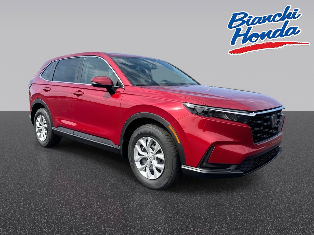 New 2026 Radiant Red Metallic Honda AWD LX image 1