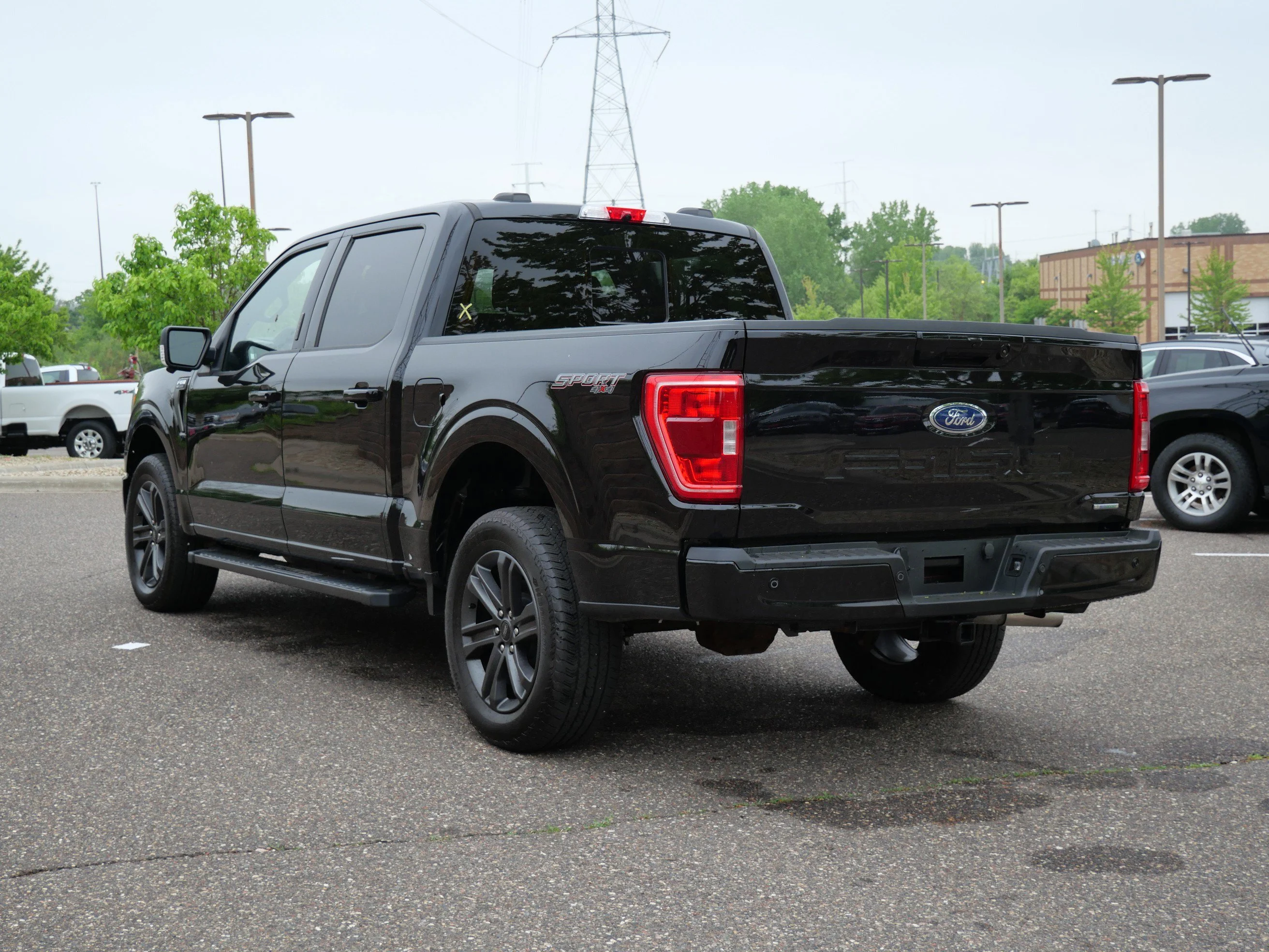 Certified Used 2023 Agate Black Metallic Ford XLT 4WD SuperCrew 5.5 Box image 4