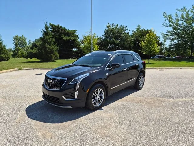 Used 2021 STELLAR BLACK METALLIC Cadillac AWD Premium Luxury image 1