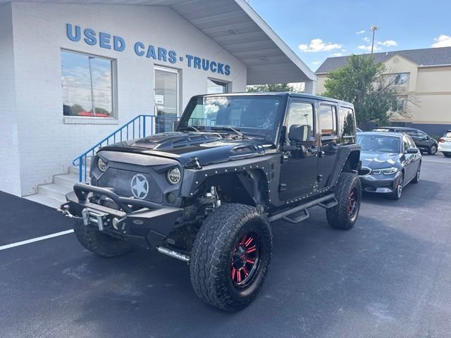 Used 2013 Black Jeep Unlimited Sahara image 2