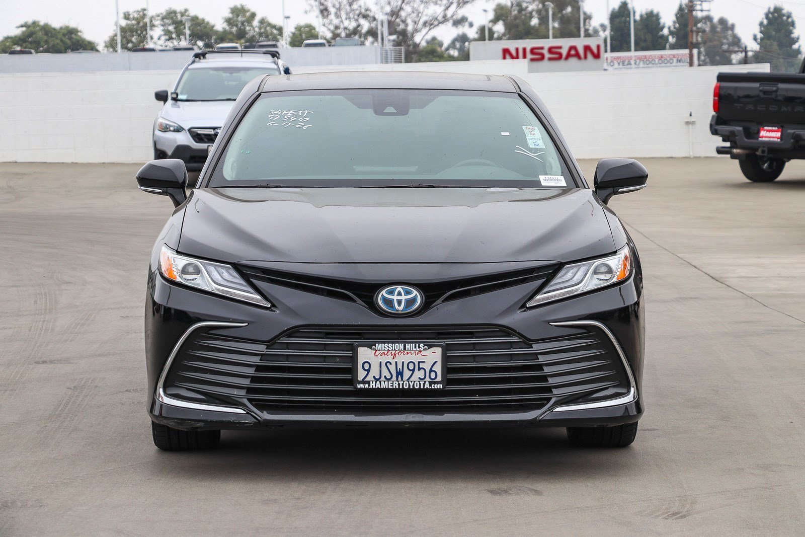 Used 2024 Midnight Black Metallic Toyota Hybrid XLE image 2