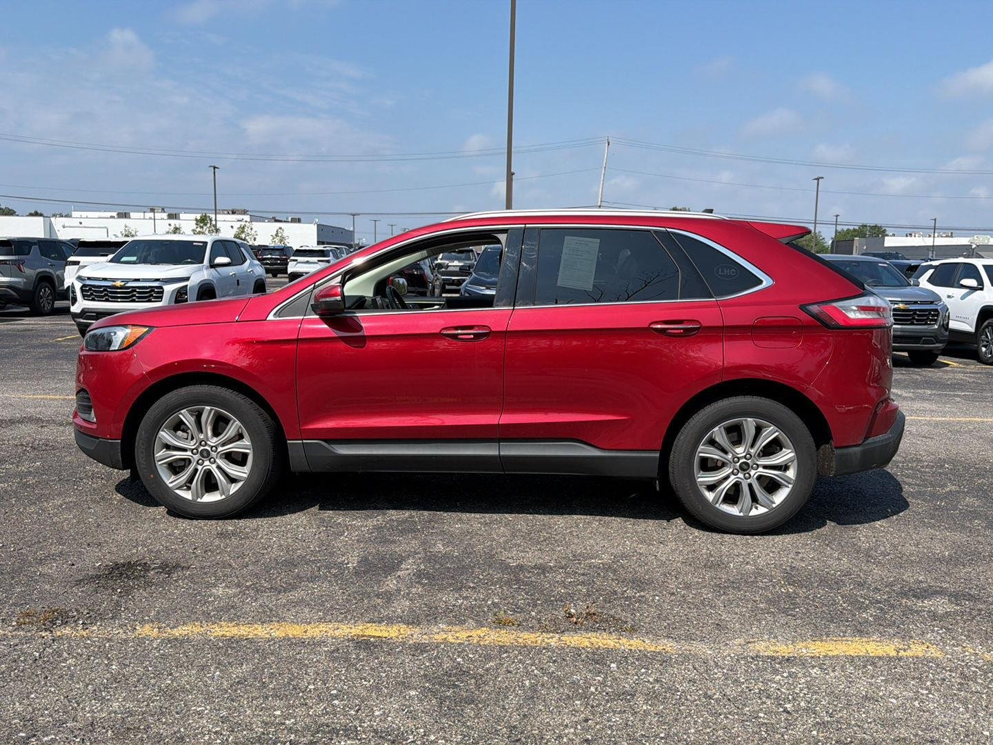 Used 2024 Rapid Red Metallic Tinted Clearcoat Ford Titanium image 6