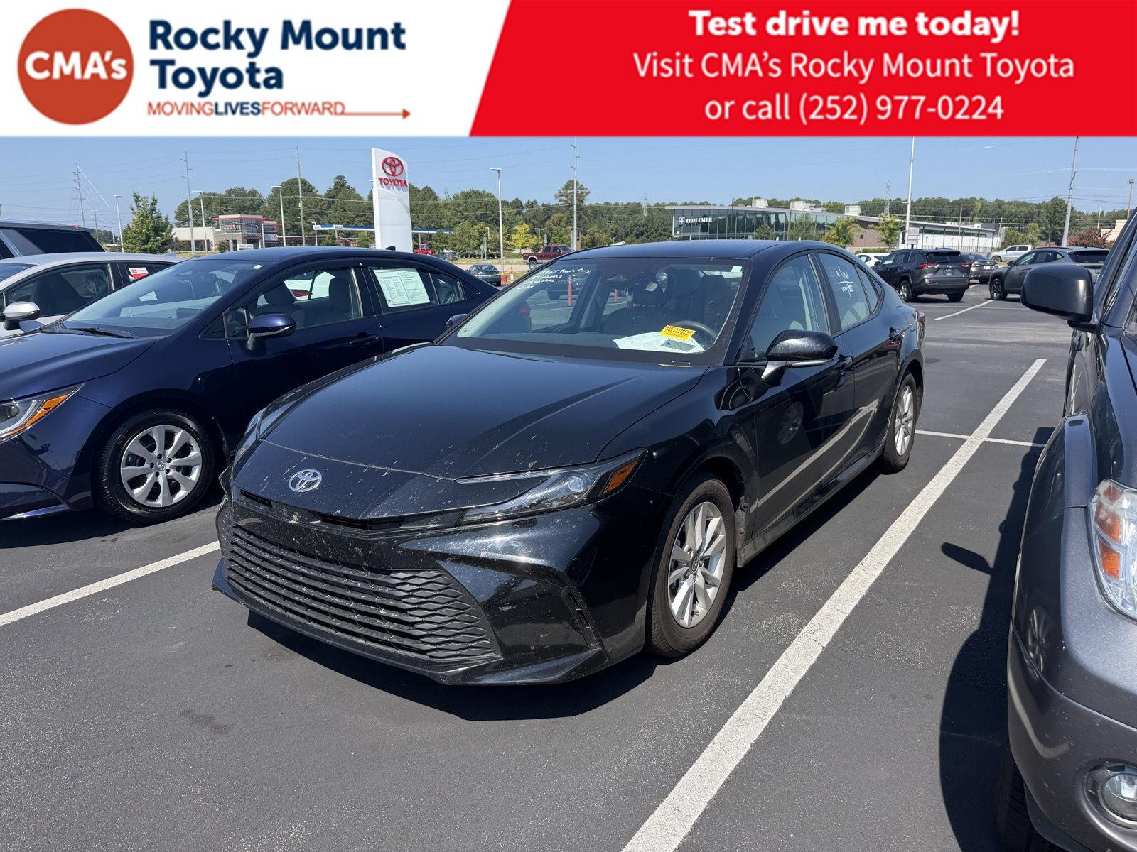 Used 2025 Midnight Black Metallic Toyota LE image 1
