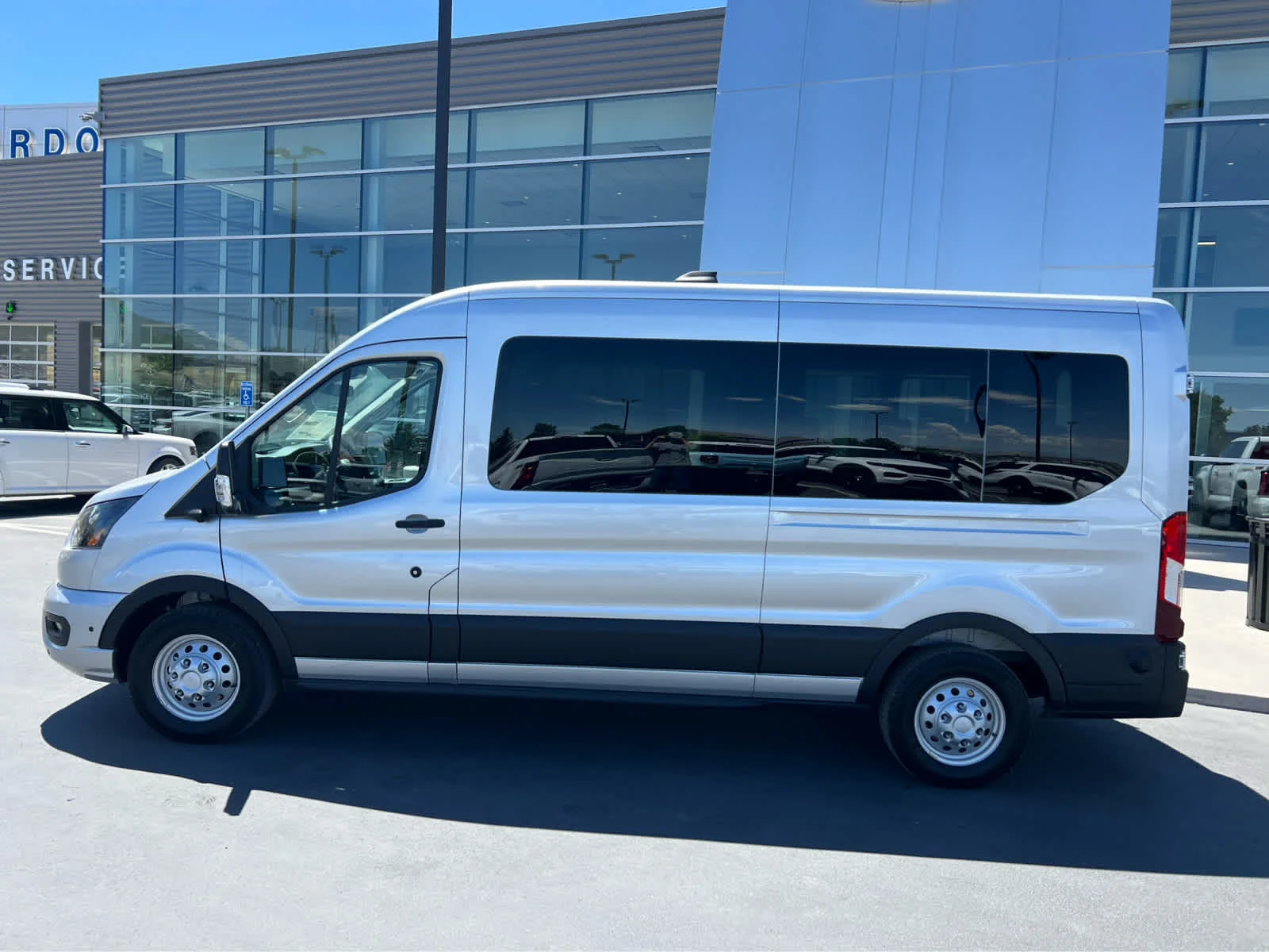 New 2026 Ingot Silver Metallic Ford Passenger Van XLT image 12