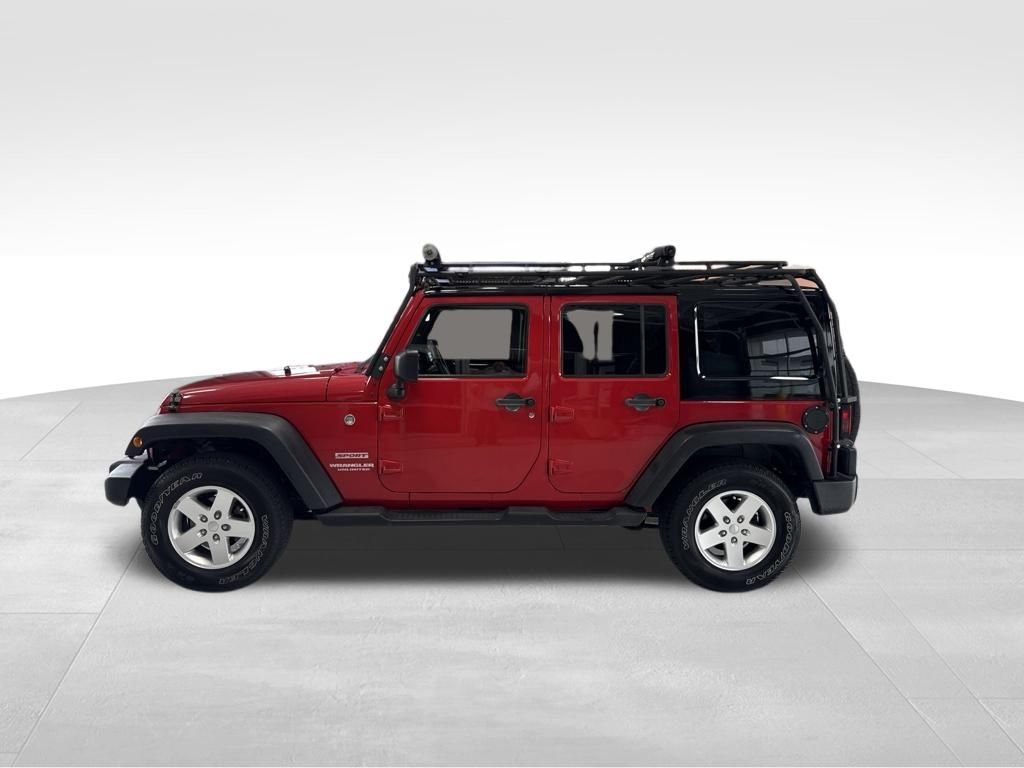 Used 2011 Red Jeep Unlimited Sport image 2
