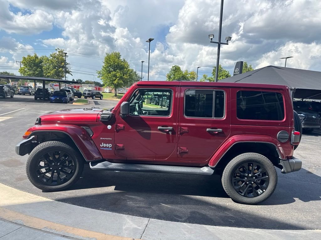 Used 2021 Red Jeep Unlimited Sahara 4xe image 1