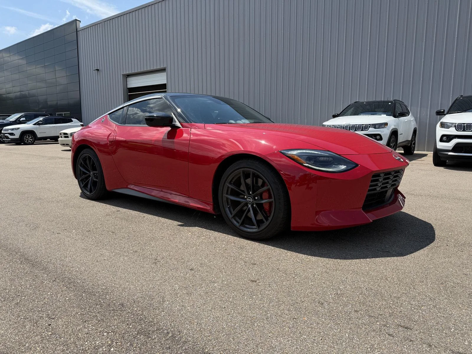 Used 2025 Solid Red/Super Black Nissan Performance image 3