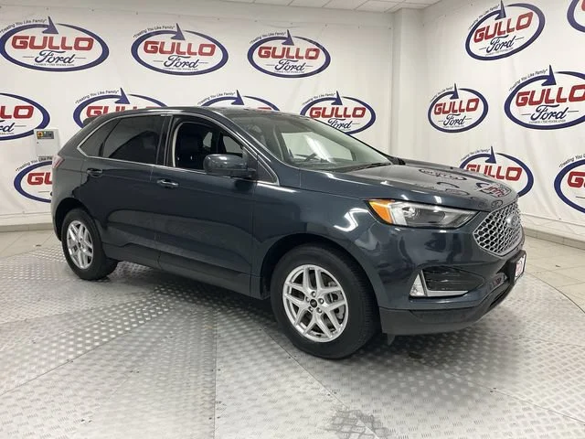 Used 2024 Blue Metallic Ford SEL image 1