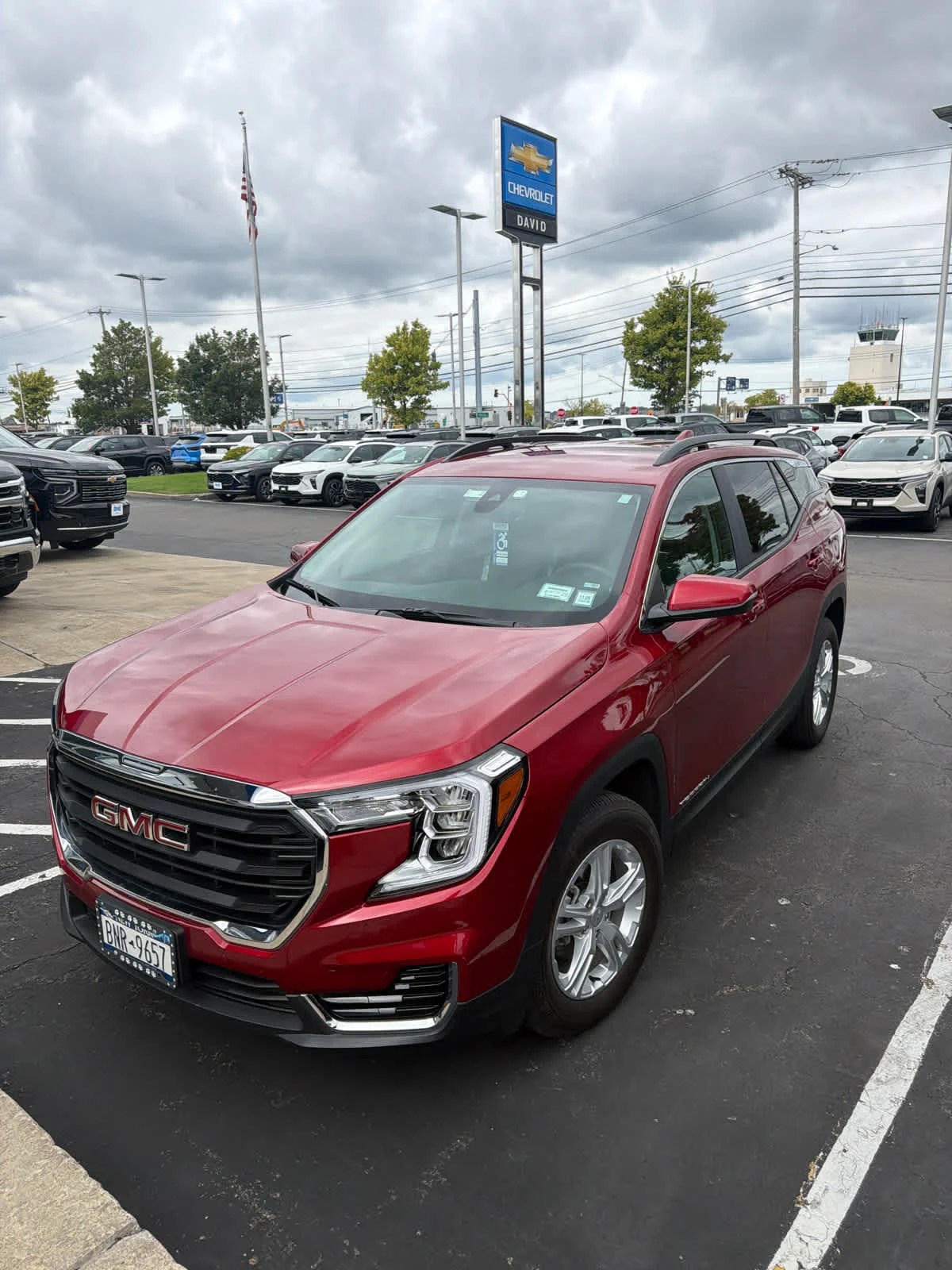 Used 2024 Volcanic Red Tintcoat GMC SLE image 1