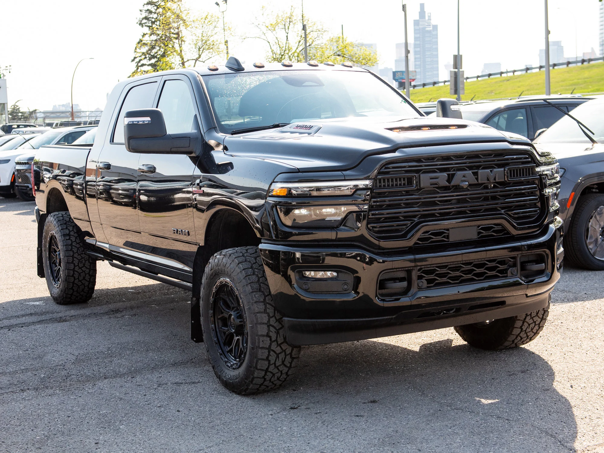 New 2026 Black RAM Laramie* Mega Cab, 2 Inch Lift, 35 Inch Tires, Trigger Industries Mudflaps image 10
