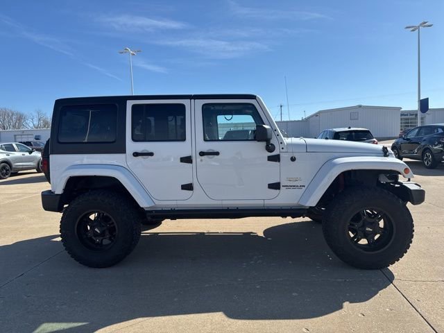 Used 2015 Jeep Wrangler Unlimited Sahara with VIN 1C4BJWEGXFL685761 for sale in Fort Madison, IA