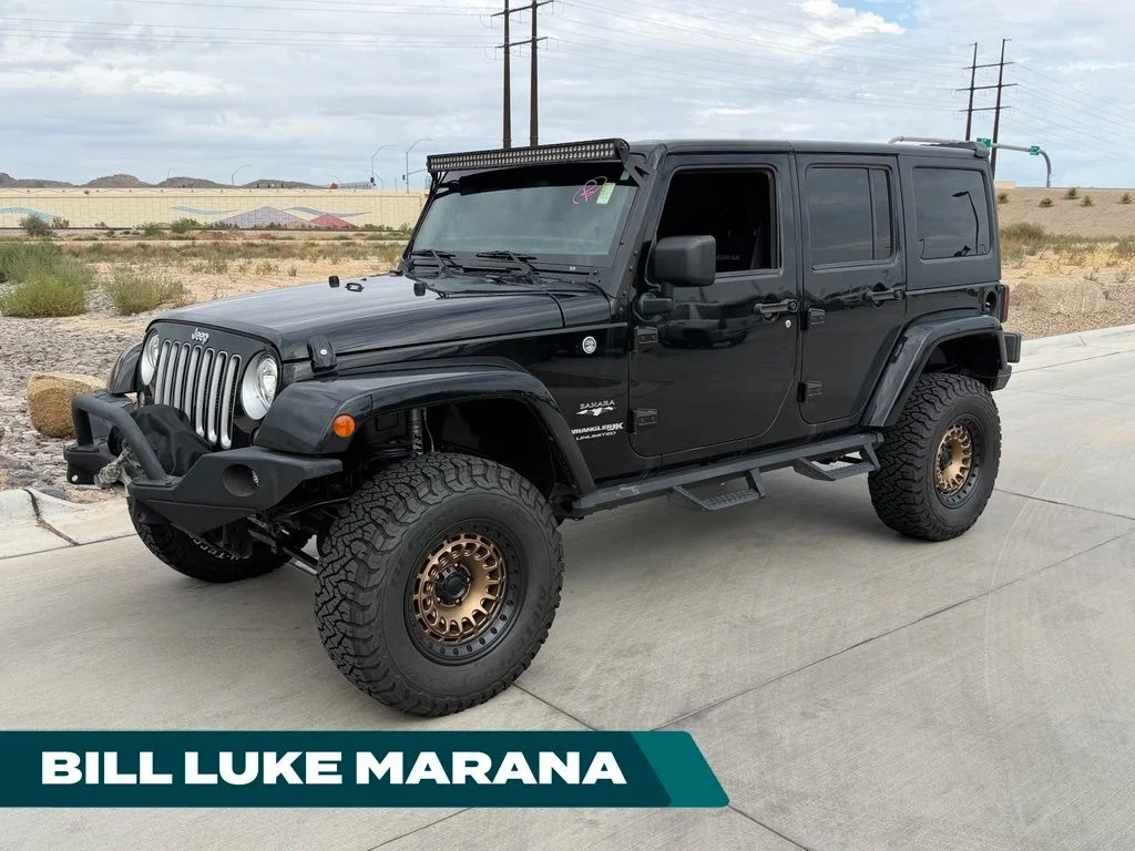 Used 2018 Black Jeep Unlimited Sahara image 1