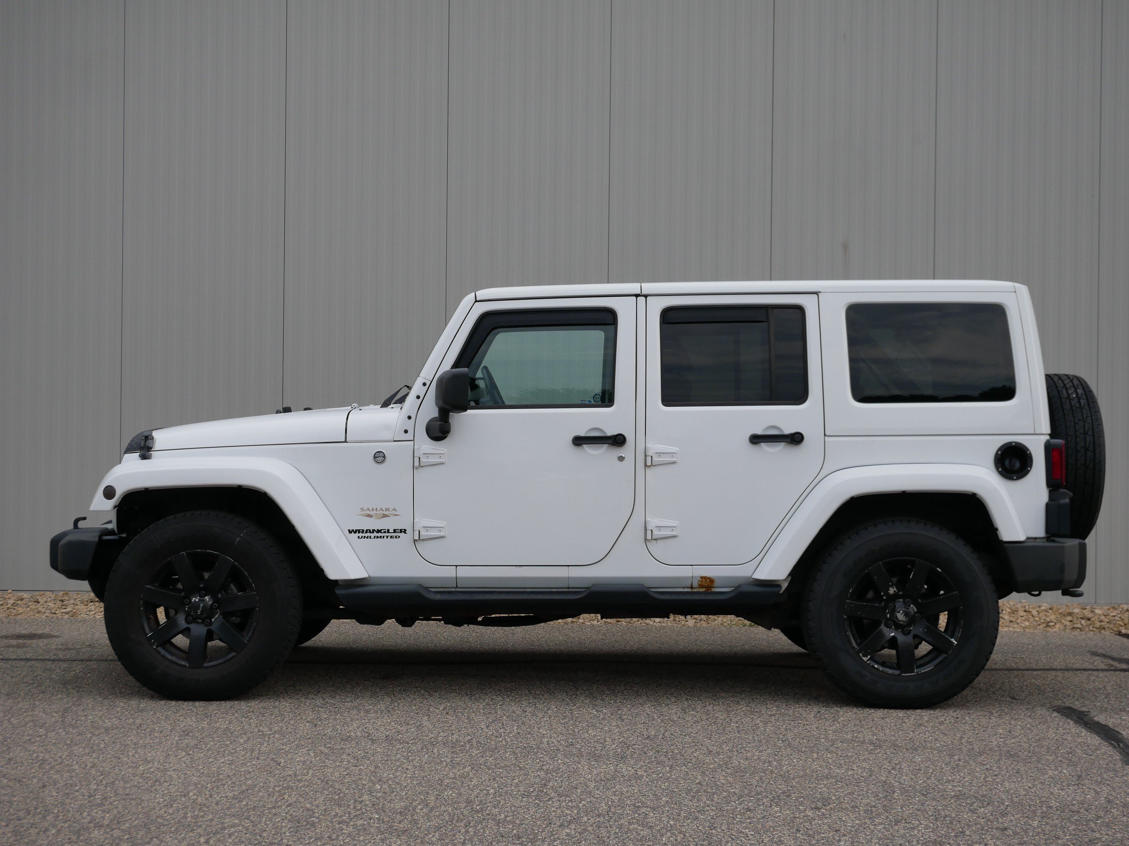 Used 2013 Jeep Wrangler Unlimited Sahara with VIN 1C4BJWEG5DL603609 for sale in Hastings, Minnesota