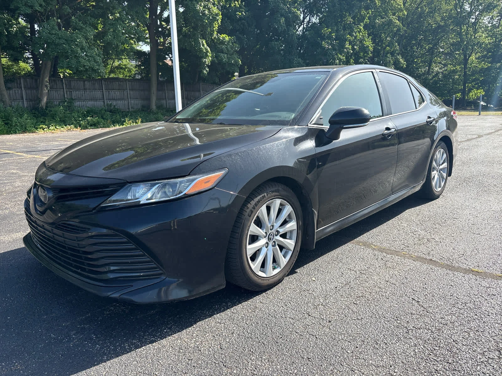 Used 2019 Midnight Black Metallic Toyota LE image 1