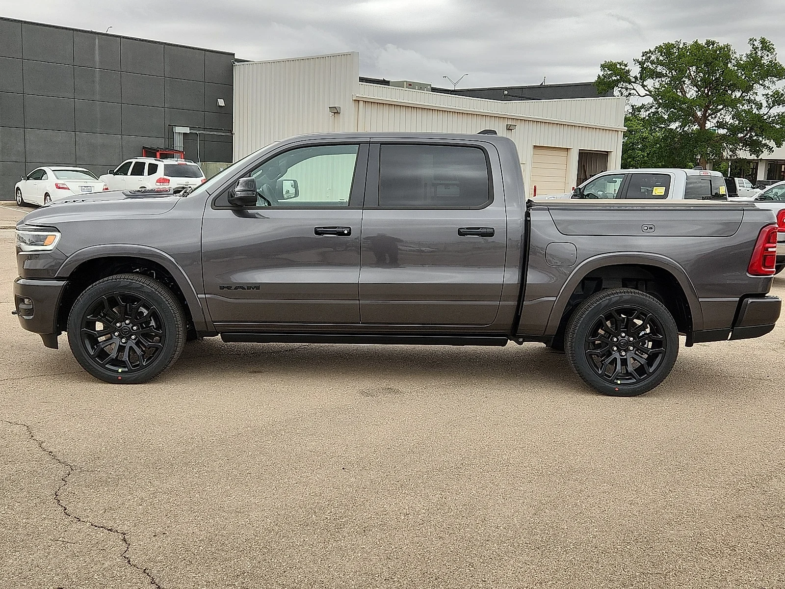 New 2026 Granite Crystal Metallic Clearcoat Ram LIMITED CREW CAB 4X4 5