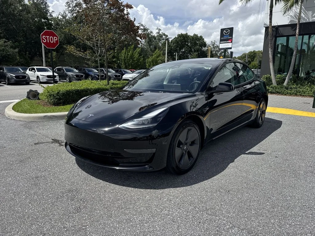 Used 2023 Solid Black Tesla  image 9