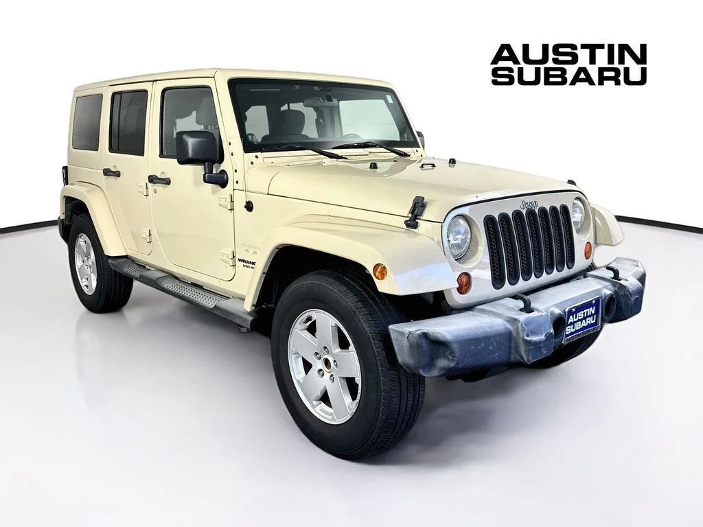 Used 2012 Beige Jeep Unlimited Sahara image 1