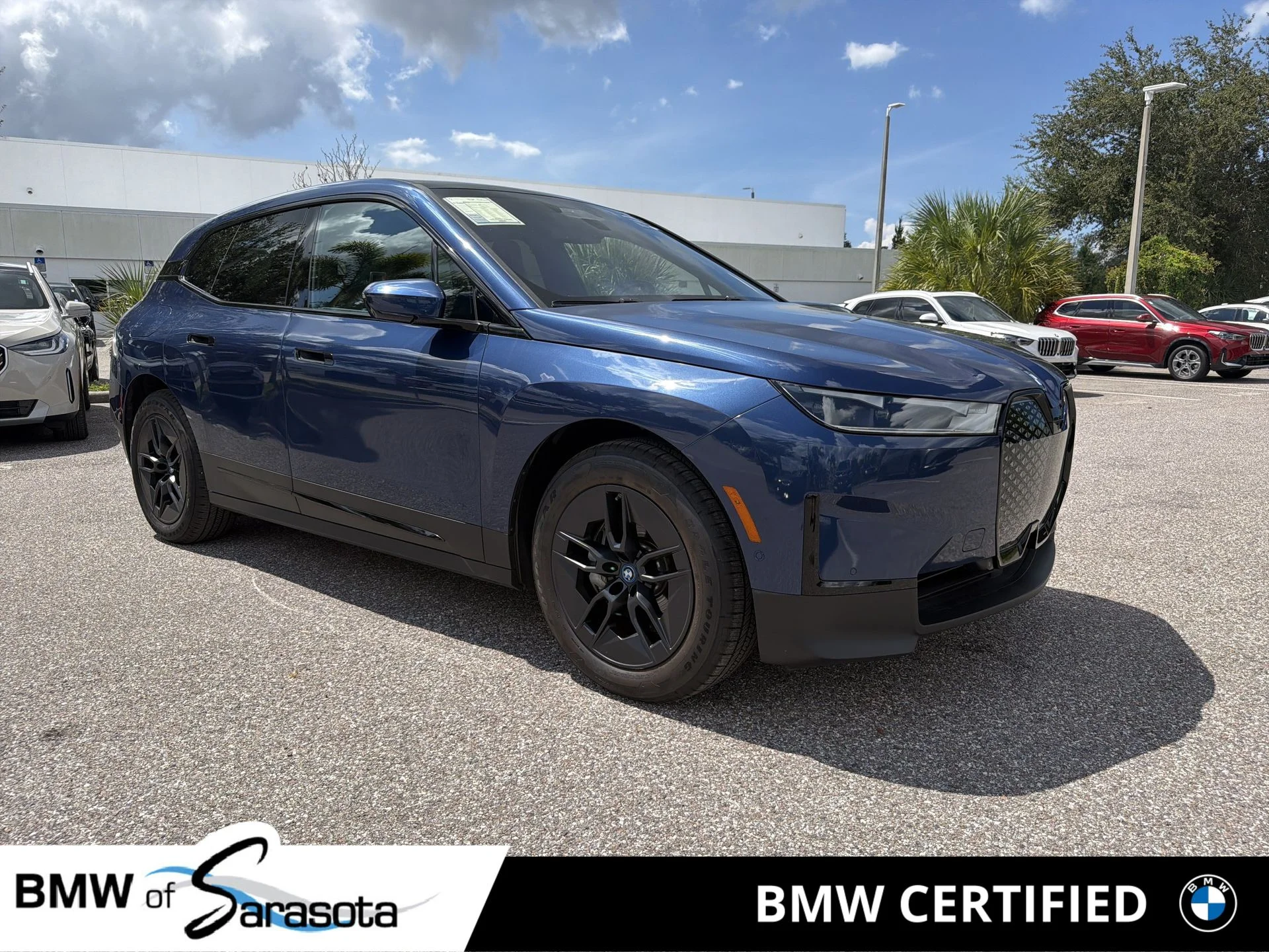 Certified Used 2023 Blue BMW xDrive50 image 1