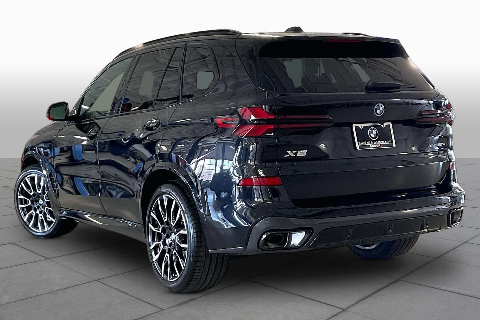 New 2026 Black Sapphire Metallic BMW xDrive50e image 12