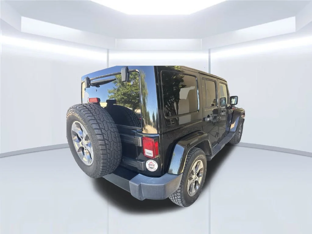 Used 2017 Black Jeep Unlimited Sahara image 4