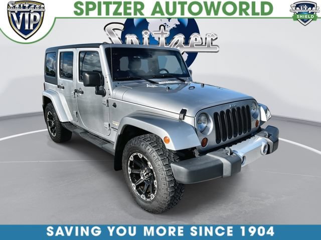 Used 2011 Silver Jeep Sahara image 1