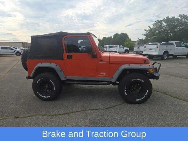 Used 2005 Impact Orange Cle Jeep Sport image 13