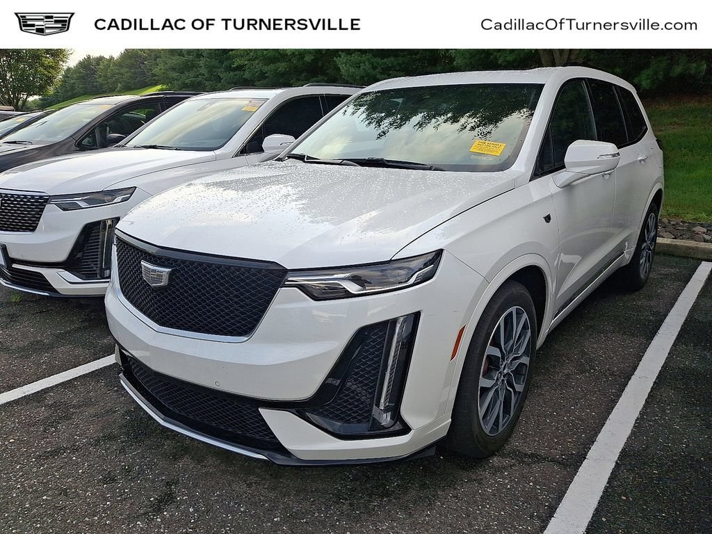 Used 2024 Crystal White Tricoat Cadillac Sport image 1