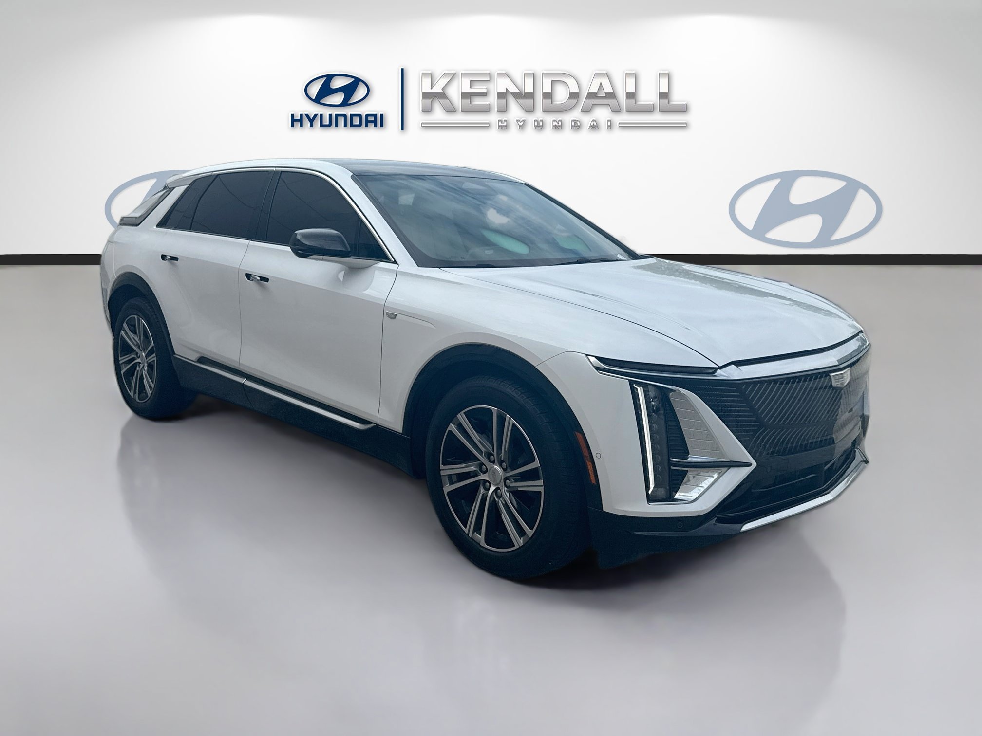 Used 2024 Emerald Lake Metallic Cadillac Sport image 1