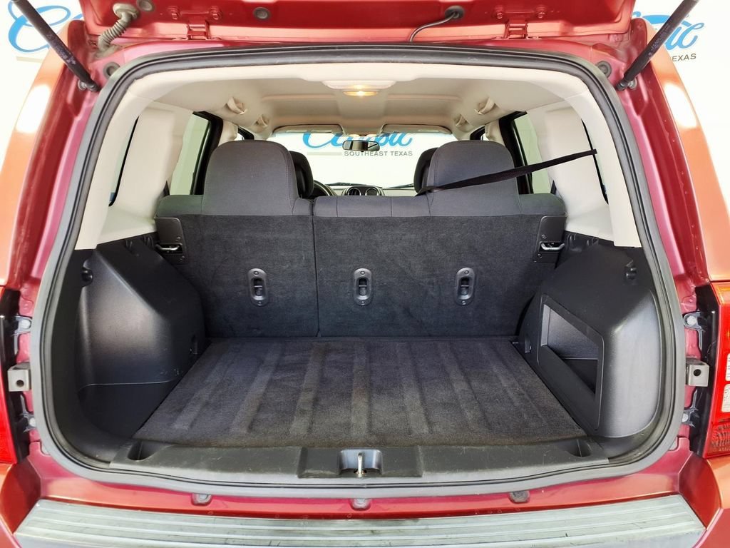 Used 2011 Deep Cherry Red Jeep Sport image 11
