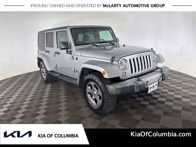 Used 2016 Silver Jeep Unlimited Sahara image 1