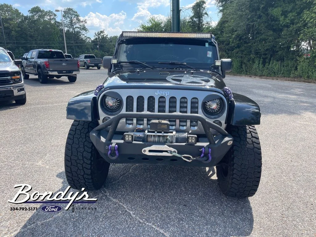 Used 2013 Black Clearcoat Jeep Unlimited Sport image 2