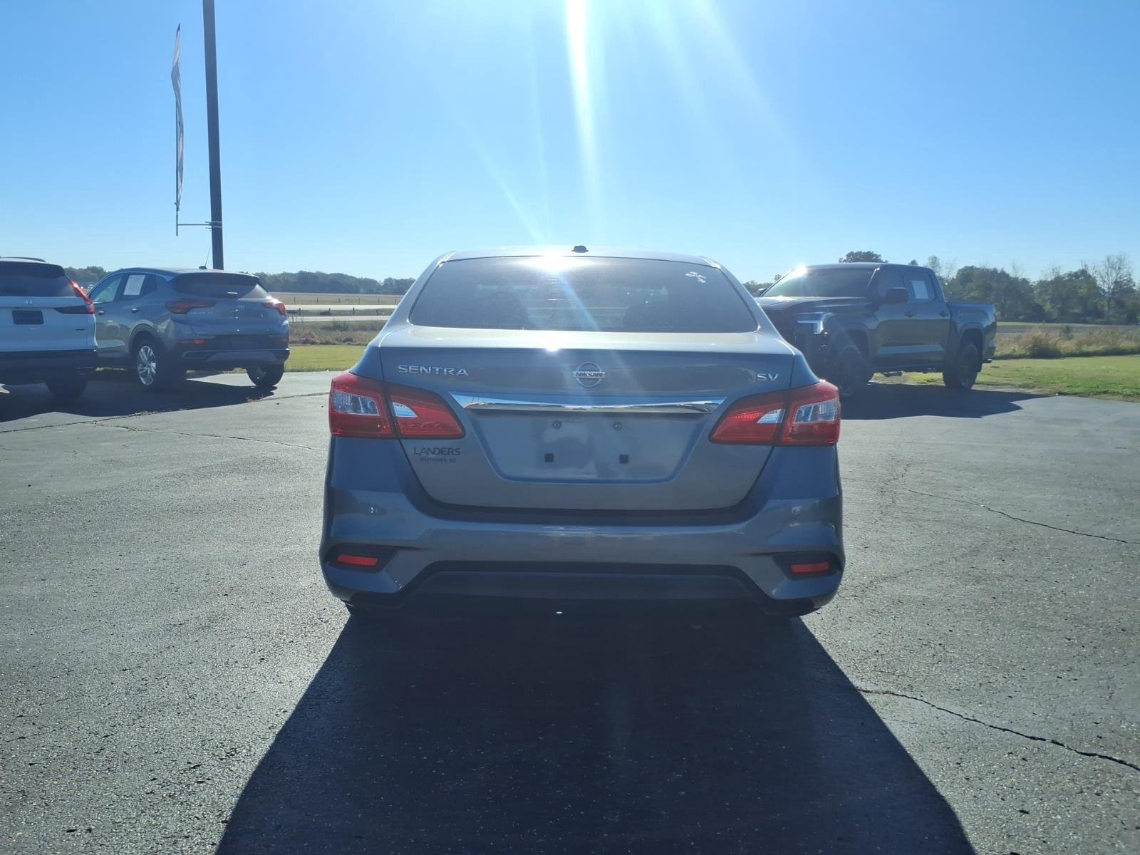 Used 2016 Gun Metallic Nissan SV image 4