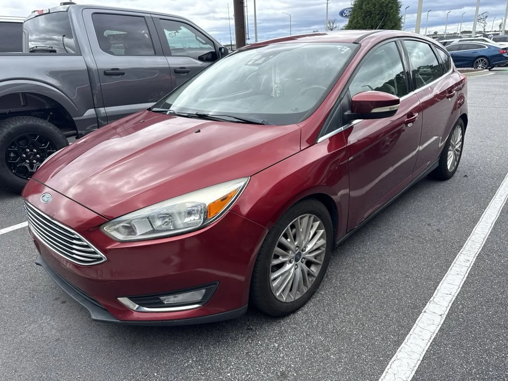 Used 2016 Ruby Red Metallic Ford Titanium image 1